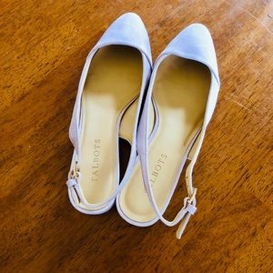 Lavender, flat sling back shoes.